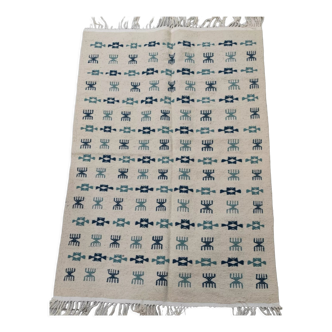 White and blue carpet woven hands in natural wool