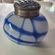 Old white and blue glass flower vase