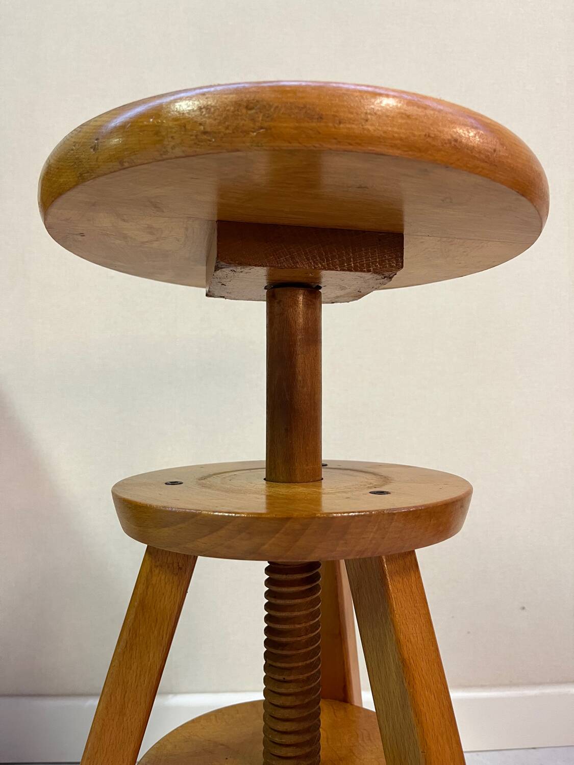 Adjustable and swivel wooden stool