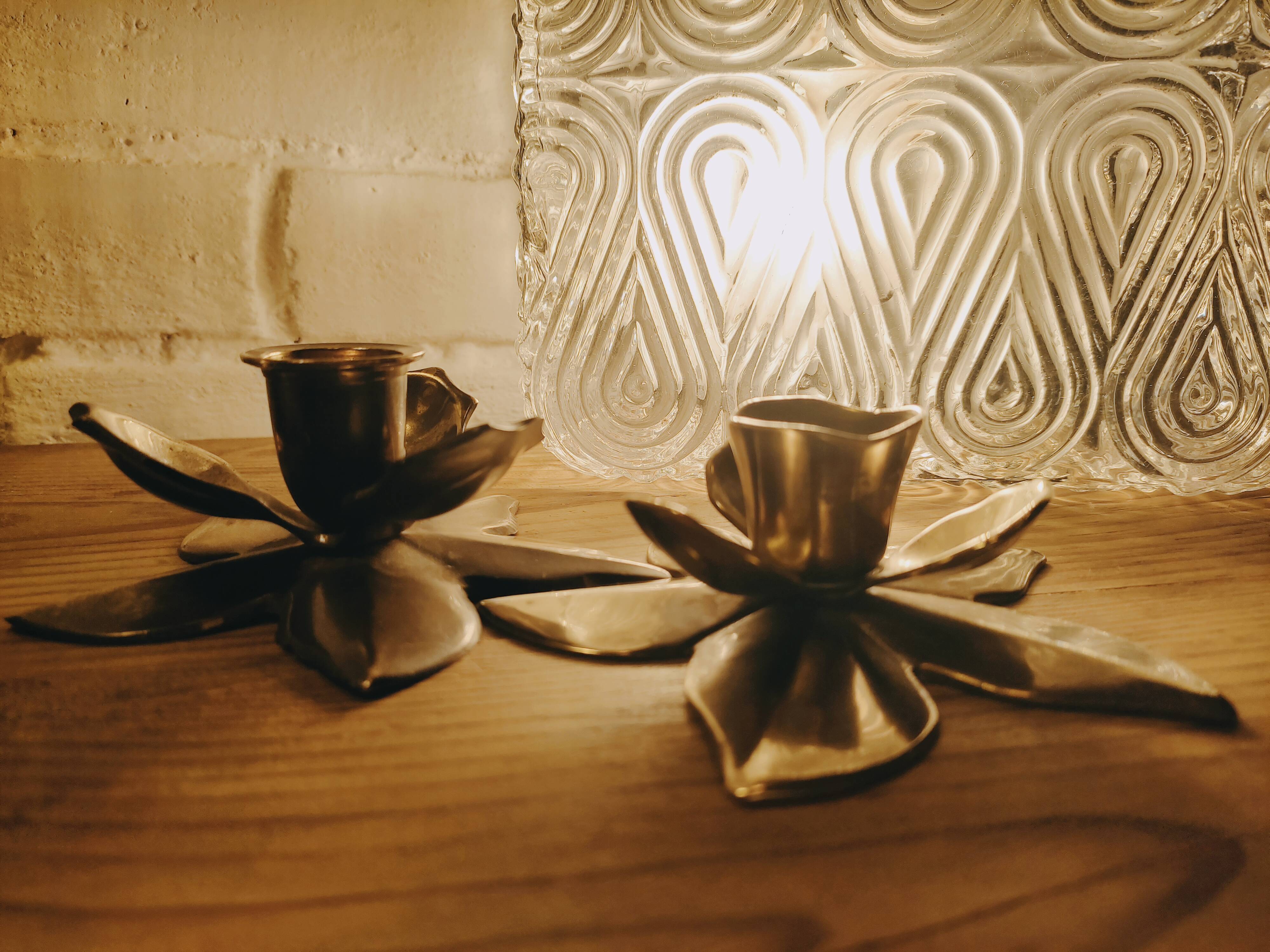 Duo of brass star candle holders