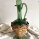 Carafe italienne vintage en verre et osier
