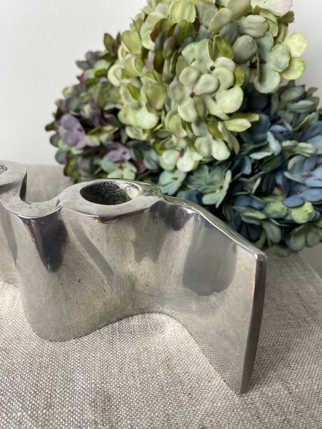 Brushed aluminum candle holder