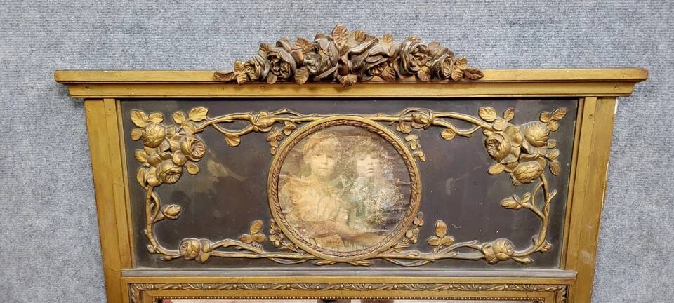 Louis XVI style trumeau mirror in wood and gilded stucco circa 1880