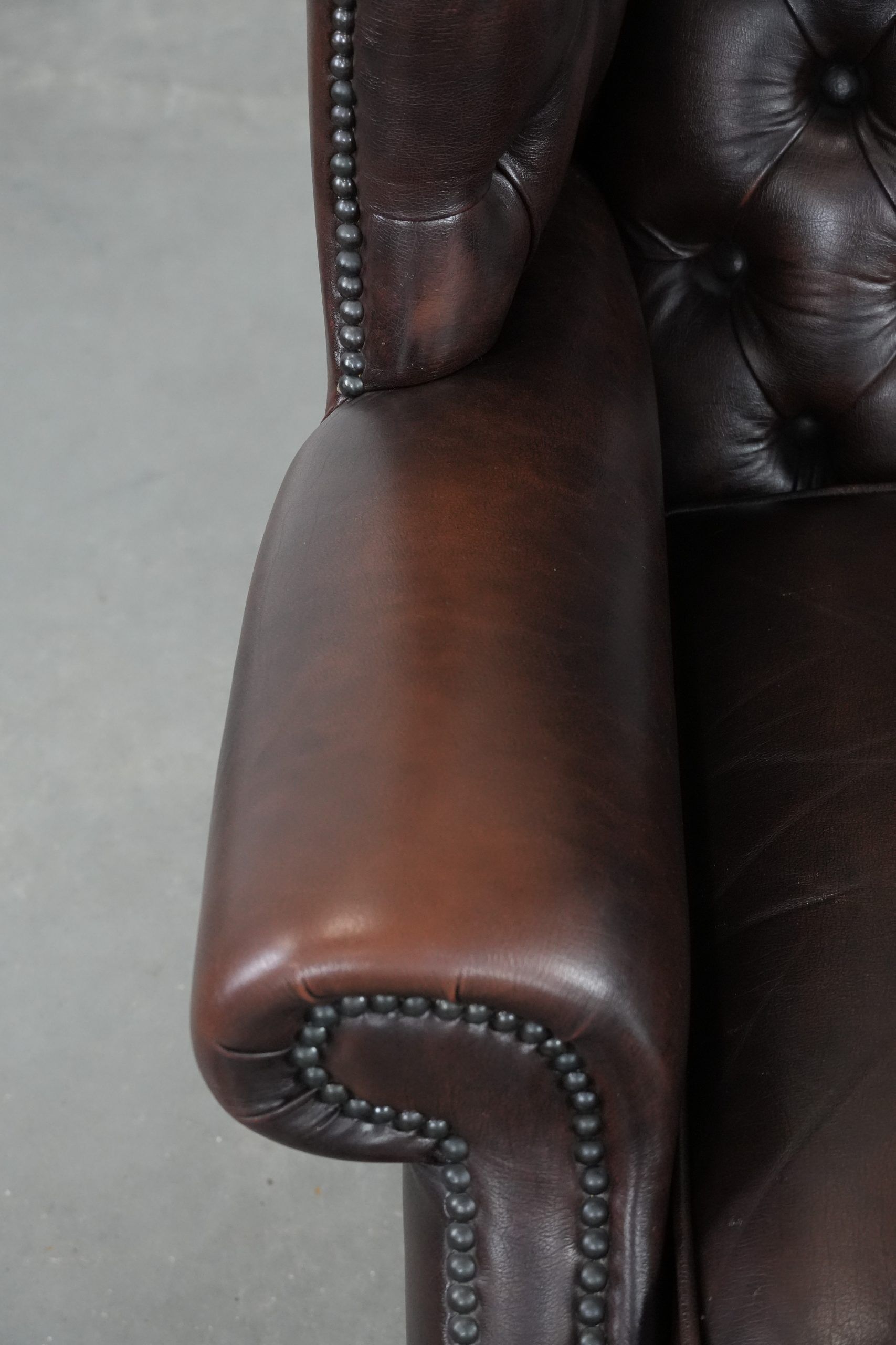 Brown cowhide leather Chesterfield wingback armchair in English style