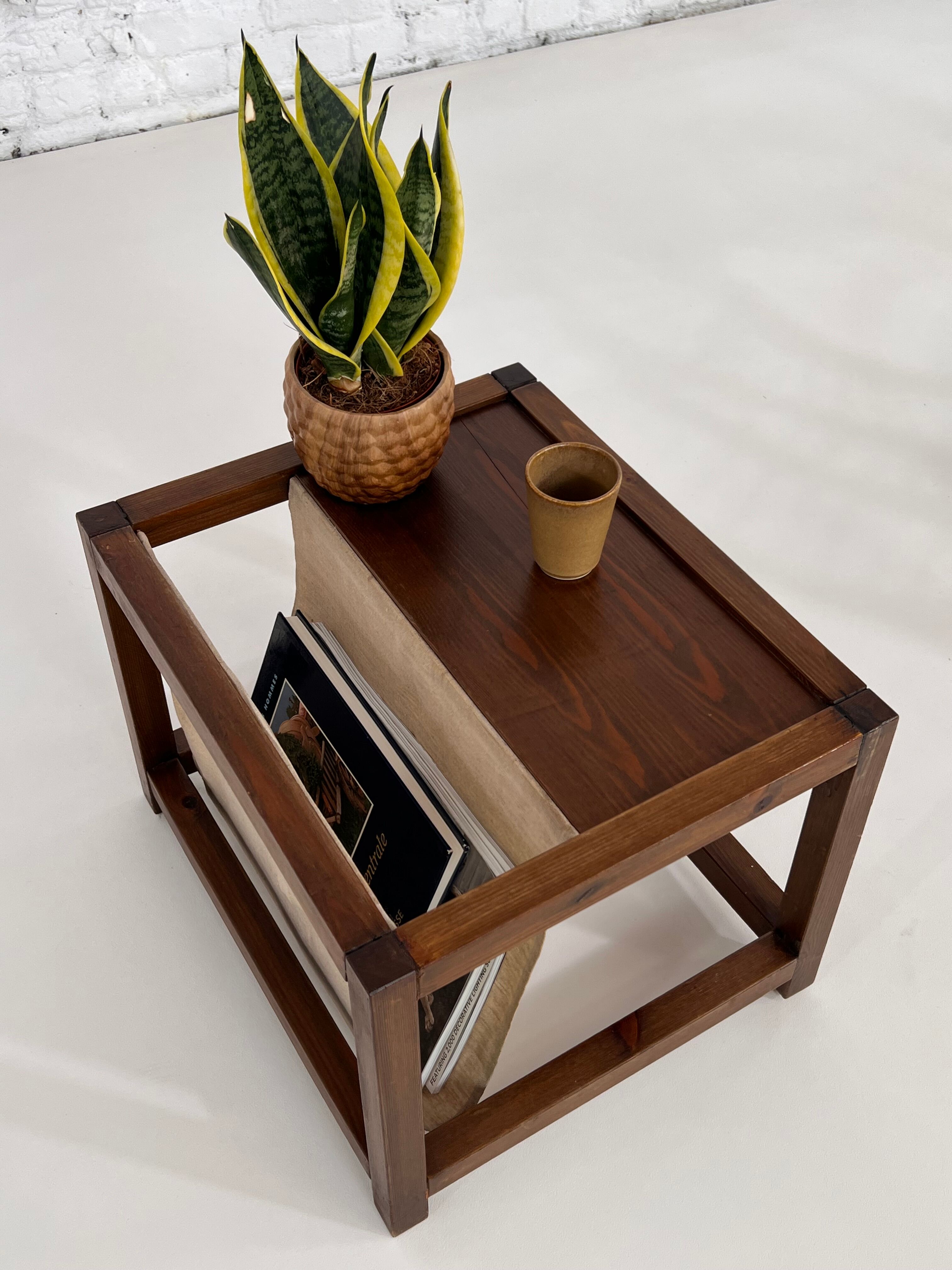 Vintage wooden sofa end with built-in fabric magazine holder