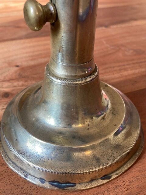 19th century brass candlestick says "to binet"