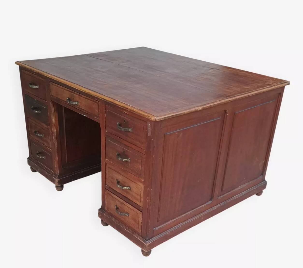 Vintage double-sided mahogany desk with 18 drawers.