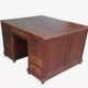 Vintage double-sided mahogany desk with 18 drawers.