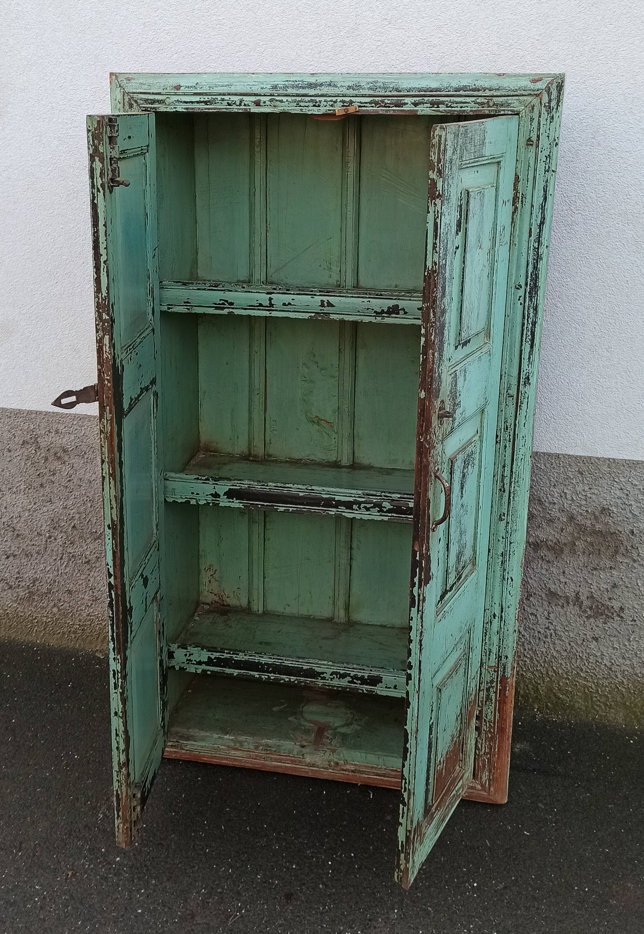 Old wooden cabinet with beautiful green patina