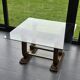 Art Deco coffee table in glass, wood, and brass.