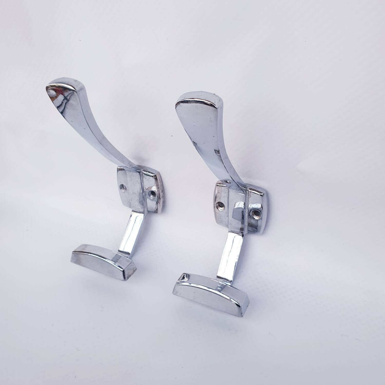 Pair of vintage chrome metal wall hooks