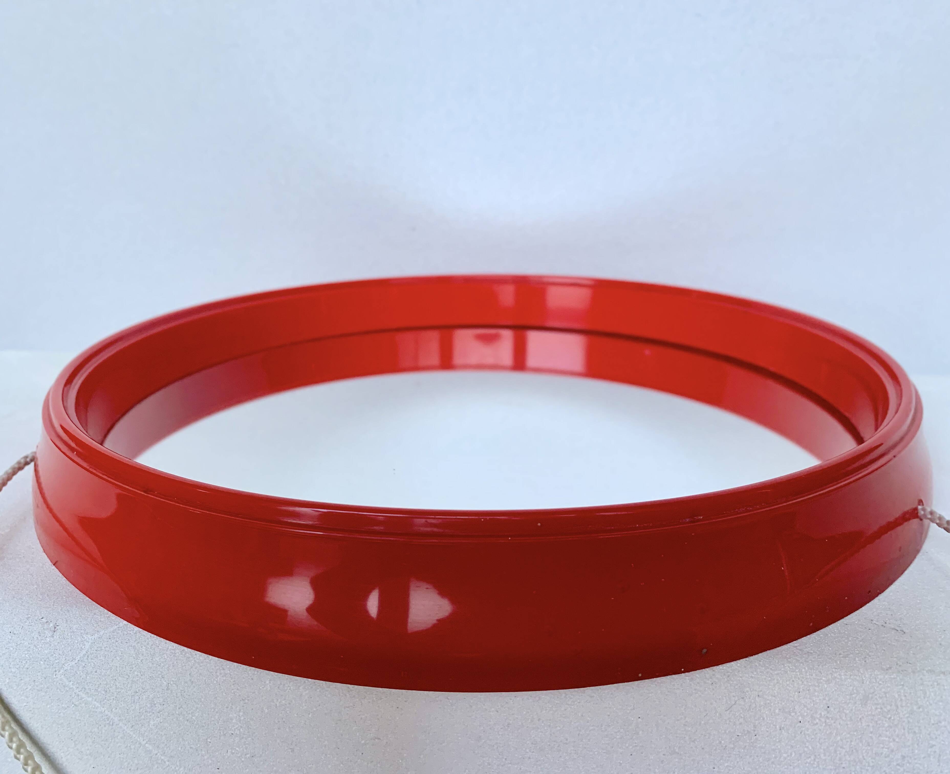 Pair of vintage round red plastic mirrors