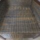 2 colonial-style armchairs in woven rattan and exotic wood