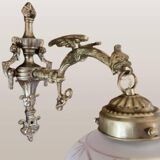 Set of 2 Empire style vintage wall sconces in the shape of a dragon from 1940-1950.