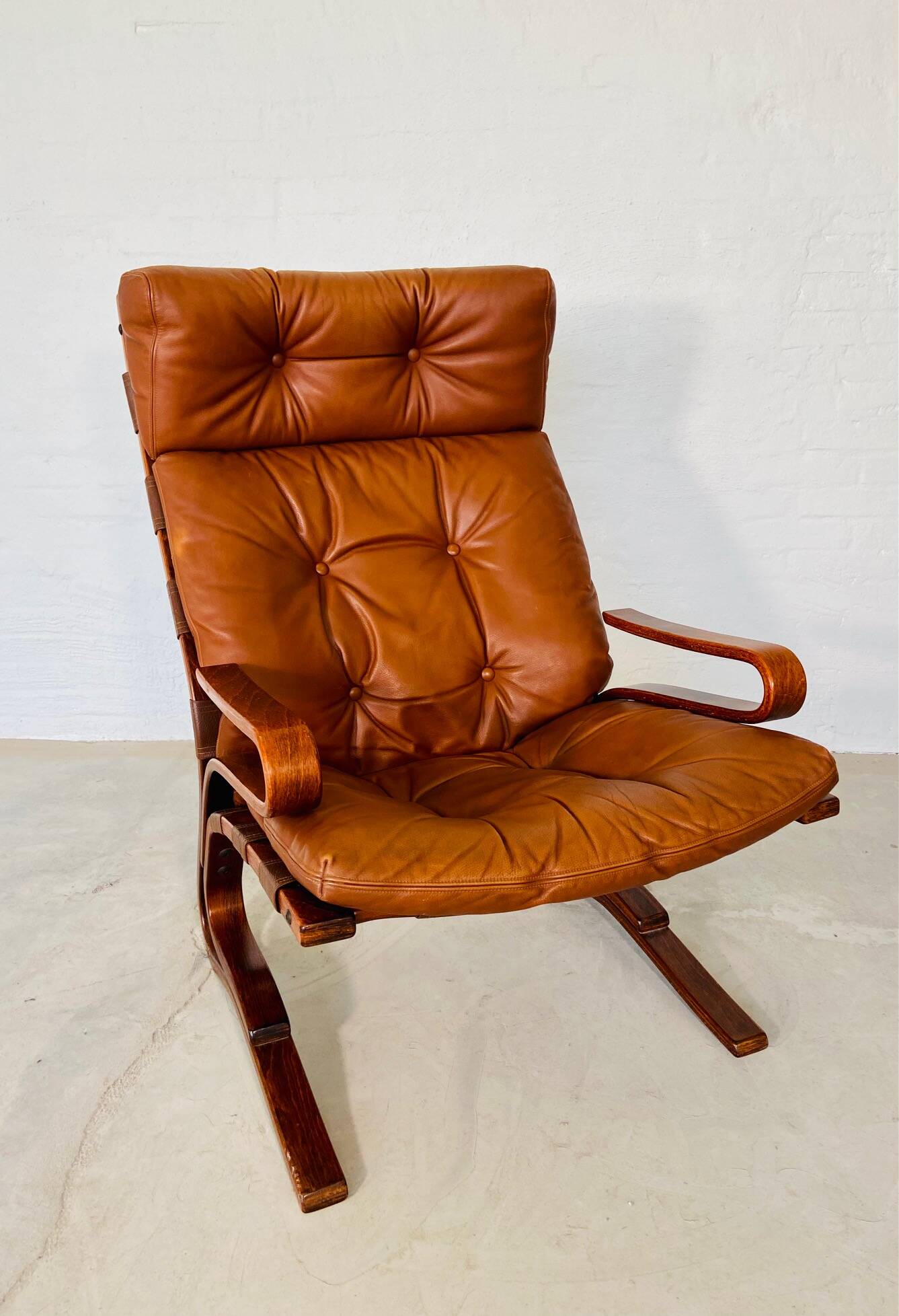 Vintage scandinavian cognac lounge chair by oddvin rykken 1960s