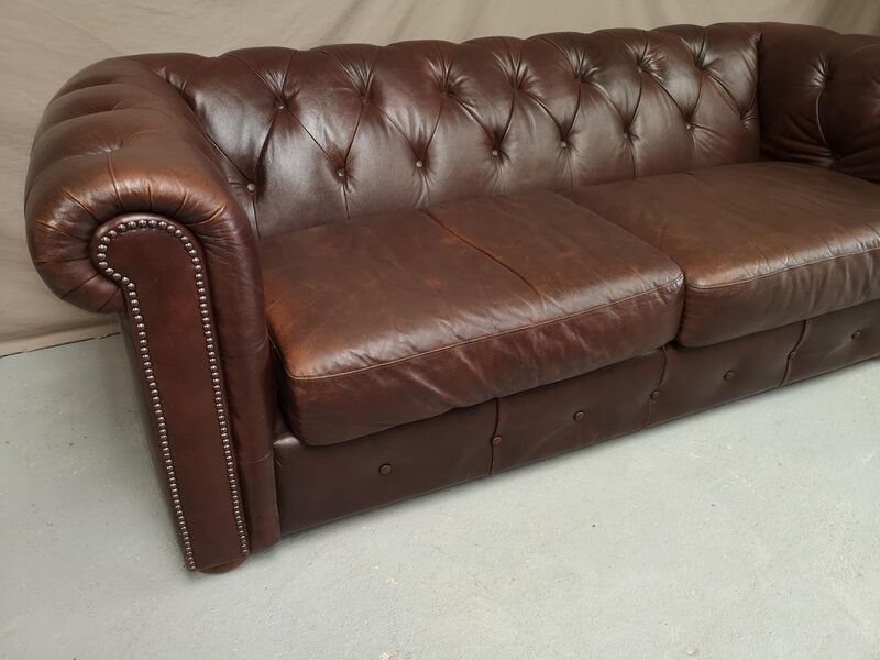 Three seater brown leather chesterfield sofa