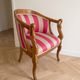 Pair of gondola armchairs with swan neck in Louis XV style, striped pink fabric.