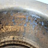 Vintage round cache-pot in hammered brass with decorative handles and patina.