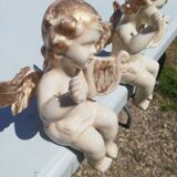 Pair of sitting angel statuettes