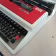 Typewriter "Burelec 315" made in Spain in red and white metal.