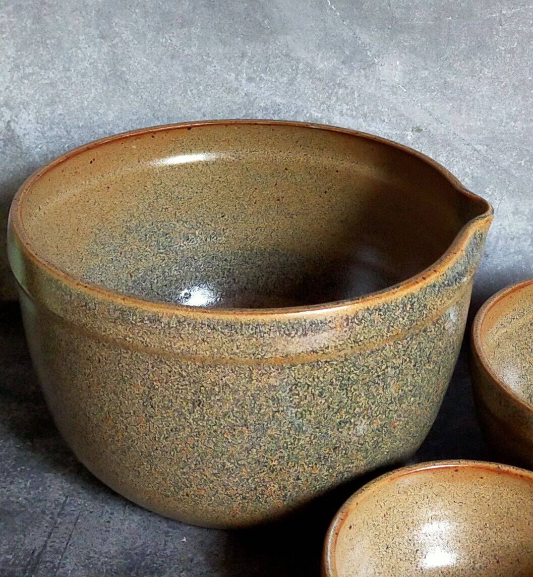 Three nesting pottery salad bowls in glazed stoneware