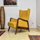 Yellow boucle wingback chair with folding footstool, 1950s