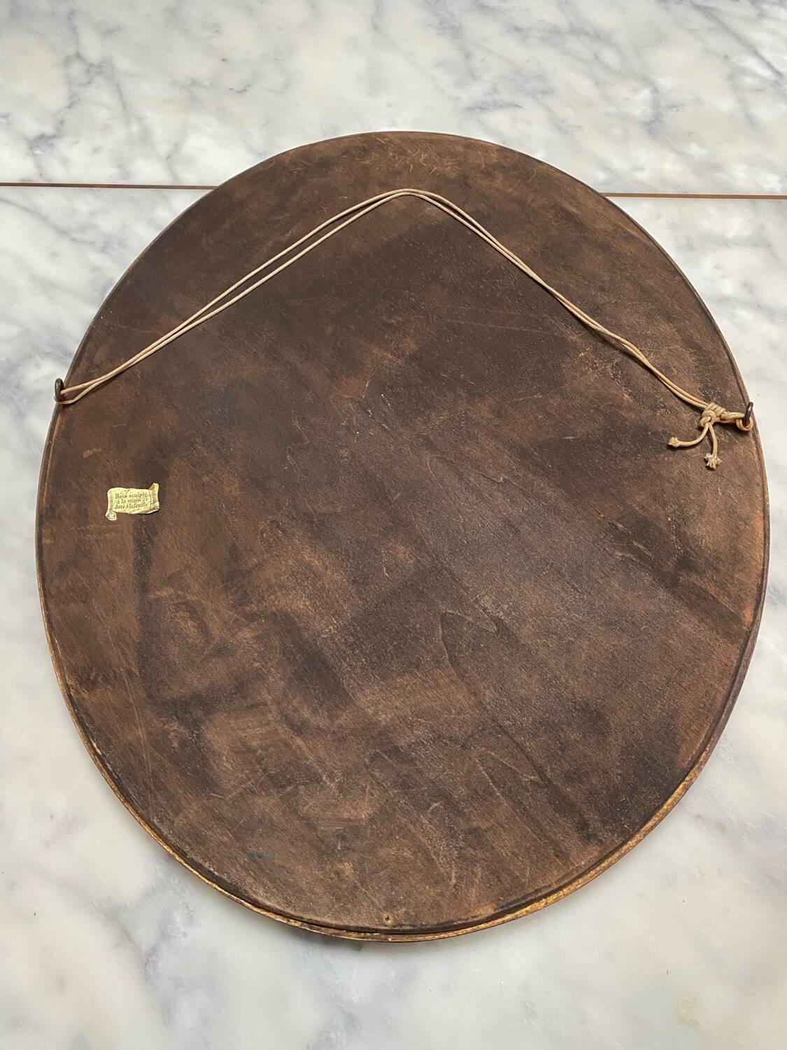 Large oval mirror in wood gilded with fine gold