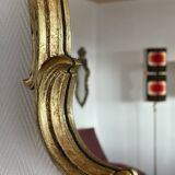 Old baroque style wall mirror with golden moldings