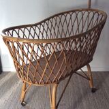 Vintage rattan cradle with its spire