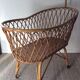 Vintage rattan cradle with its spire