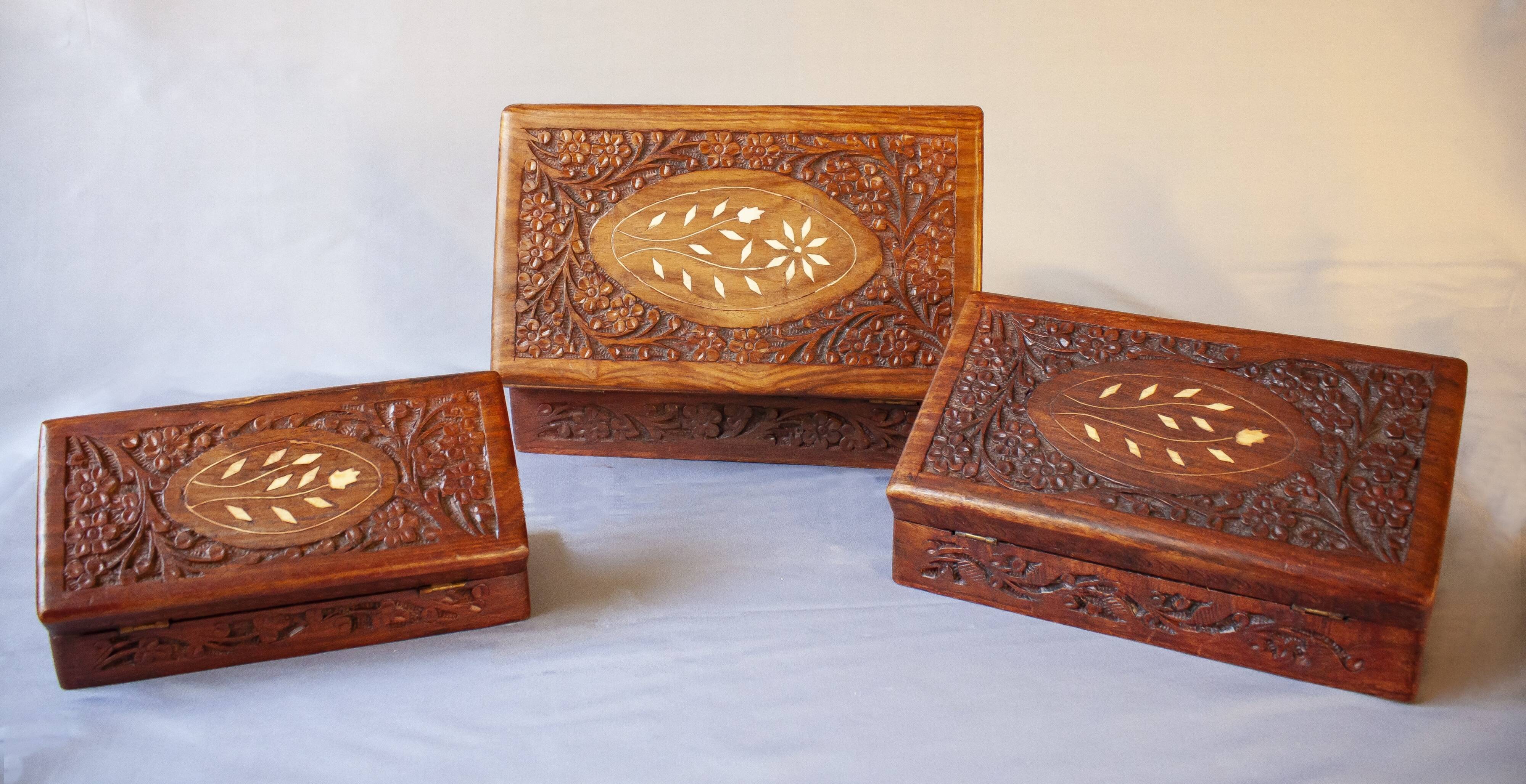 Antique hand-carved wooden boxes.