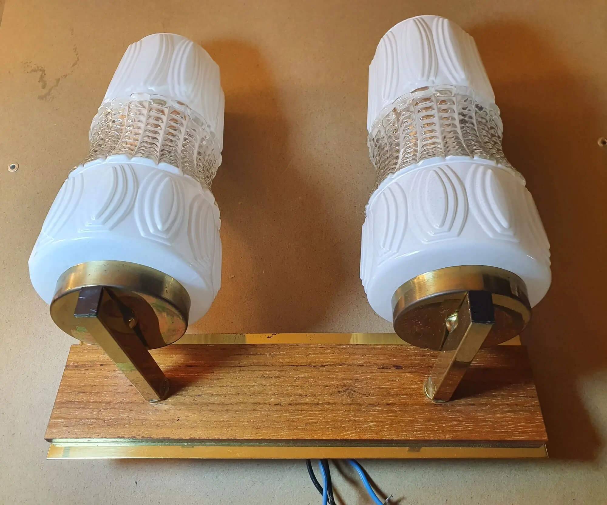 Vintage gold wall light on wooden stand