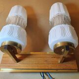 Vintage gold wall light on wooden stand