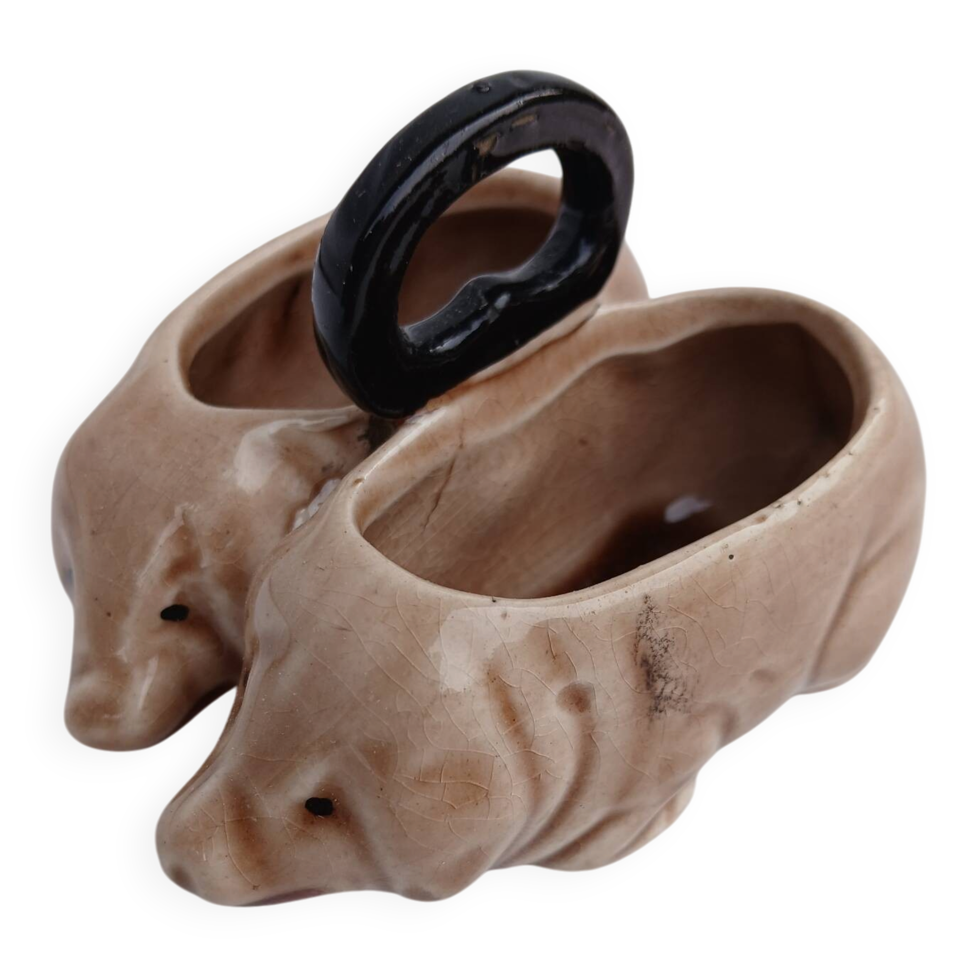 Old ceramic salt and pepper shaker in the shape of pigs.