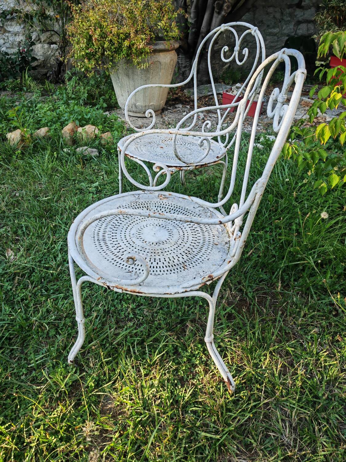 2 antique wrought iron armchairs