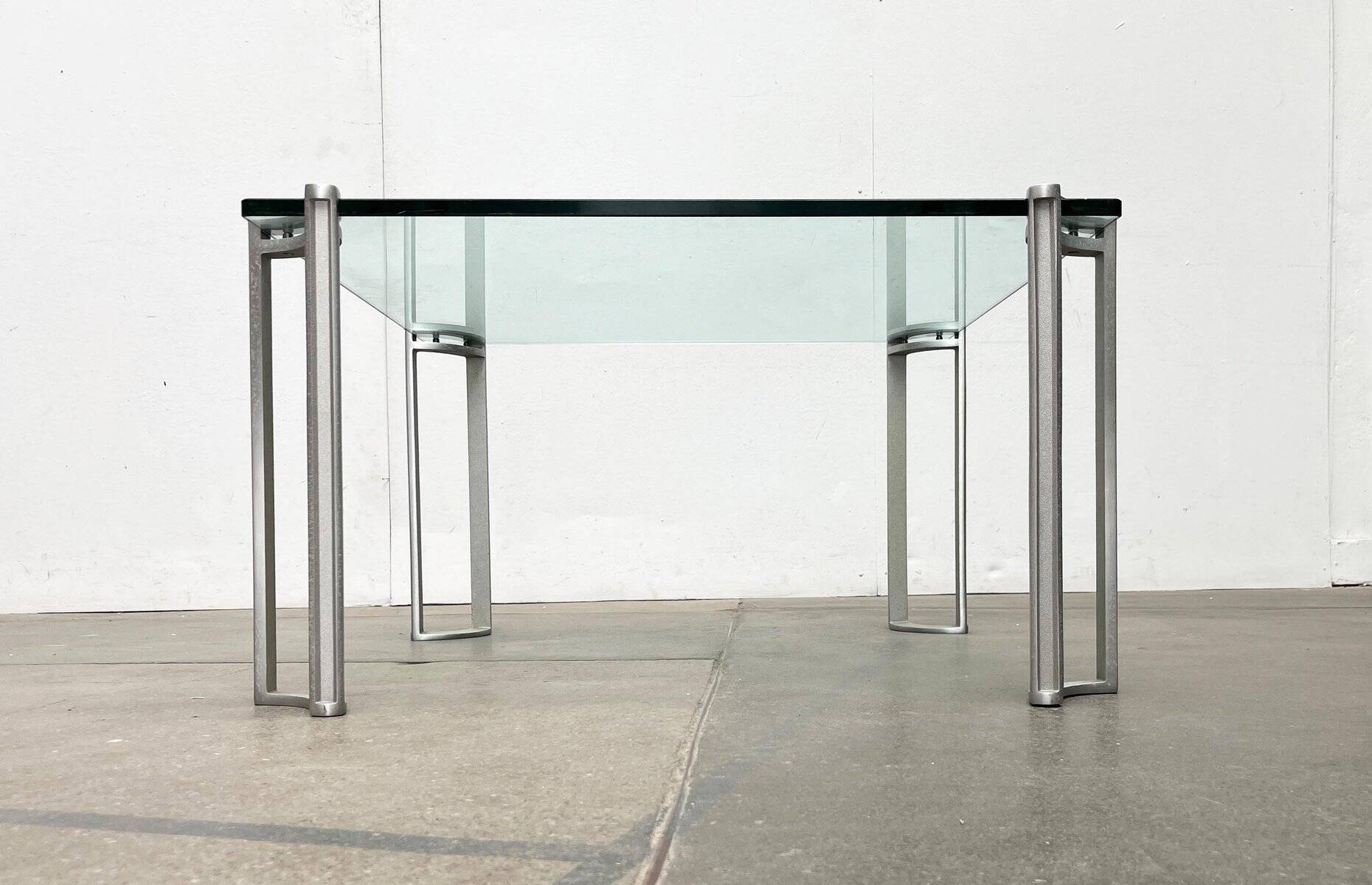 Vintage Space Age coffee table in glass and aluminium attributed to Peter Ghyczy, 1970s.