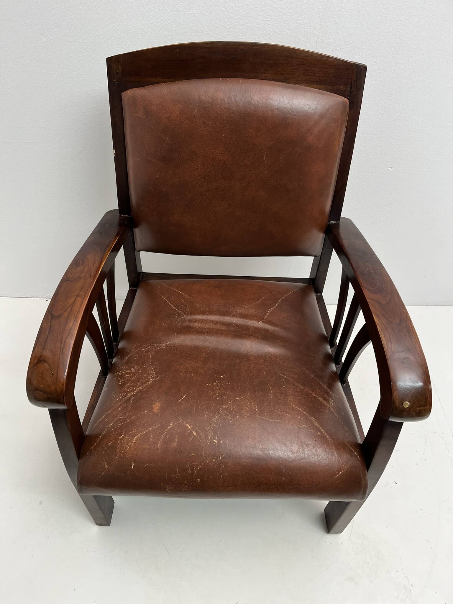 Colonial armchair in teak and leather