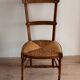 Chaise basse « nourrice » paillée vintage