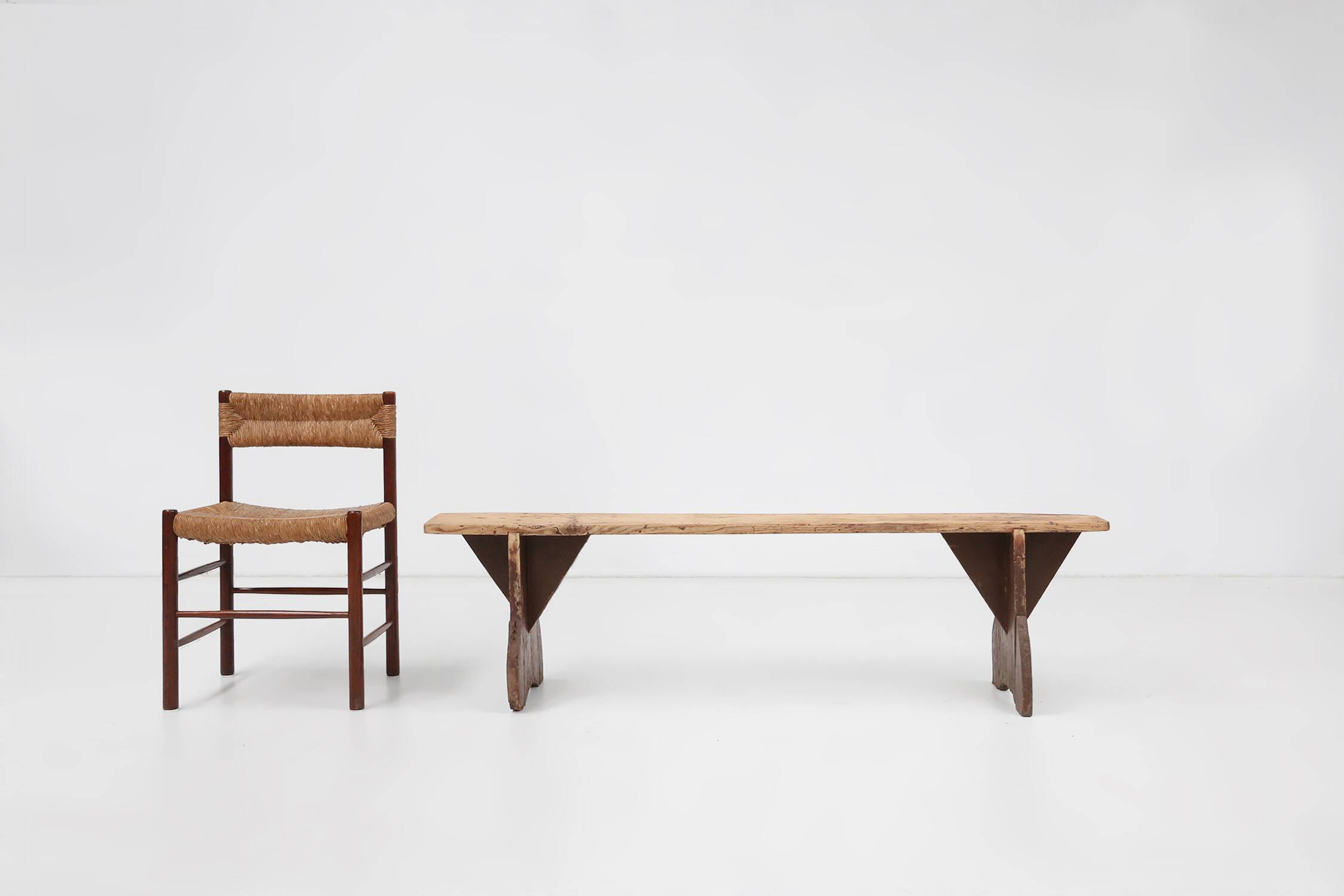 Rustic wooden bench in with brown painted feet, France ca. 1890