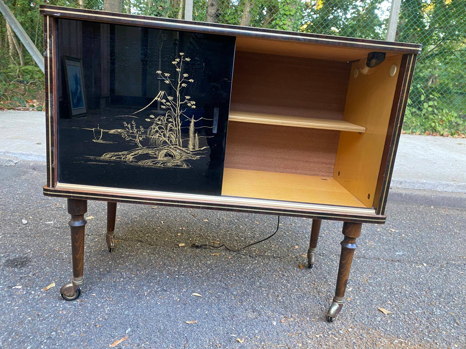 Illuminated bar cabinet Hollywood Regency black and gold 1970