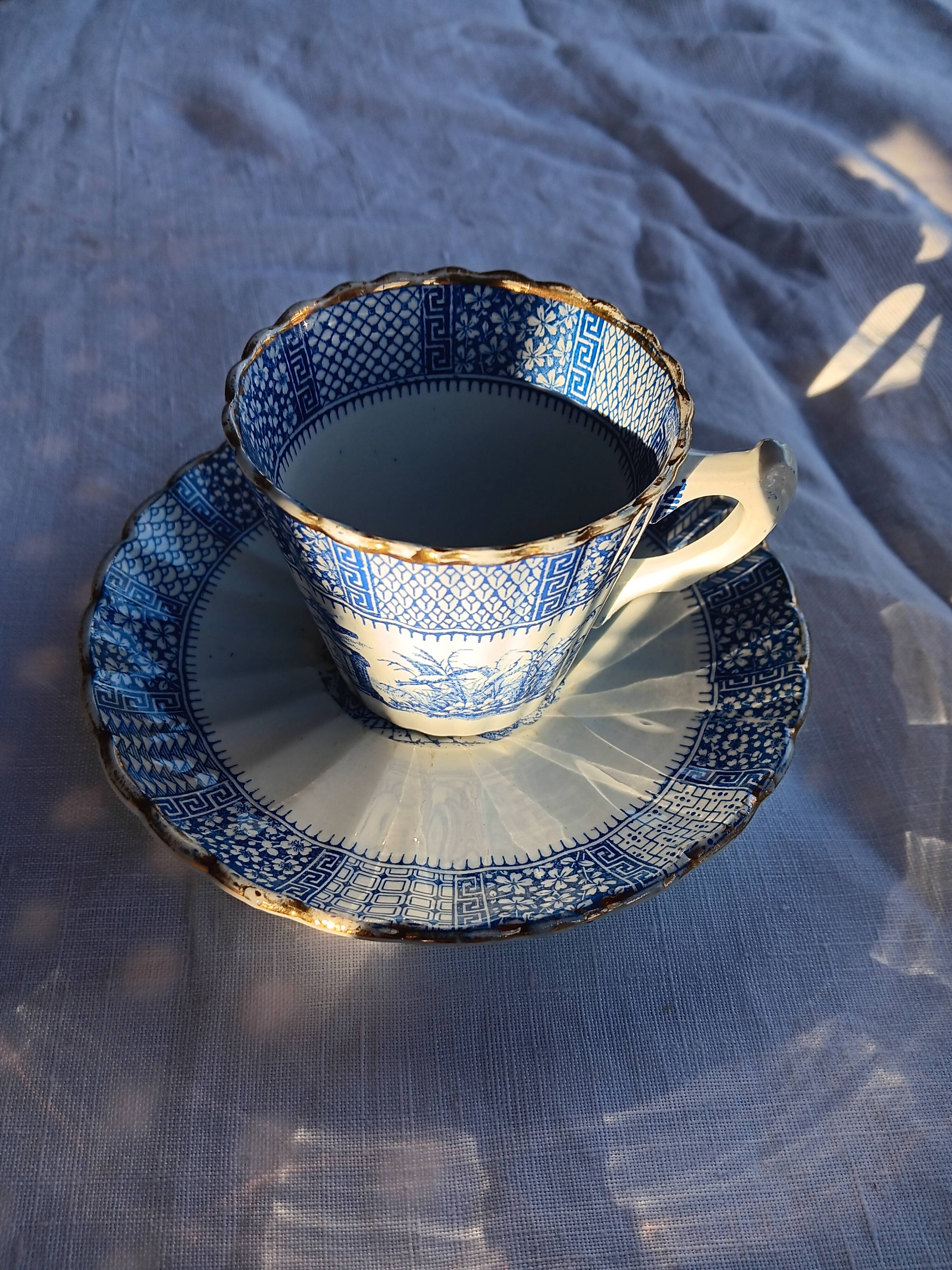 Old coffee service Lunéville with blue lace decoration.
