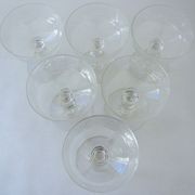 Suite of six champagne glasses on foot in engraved colorless crystal