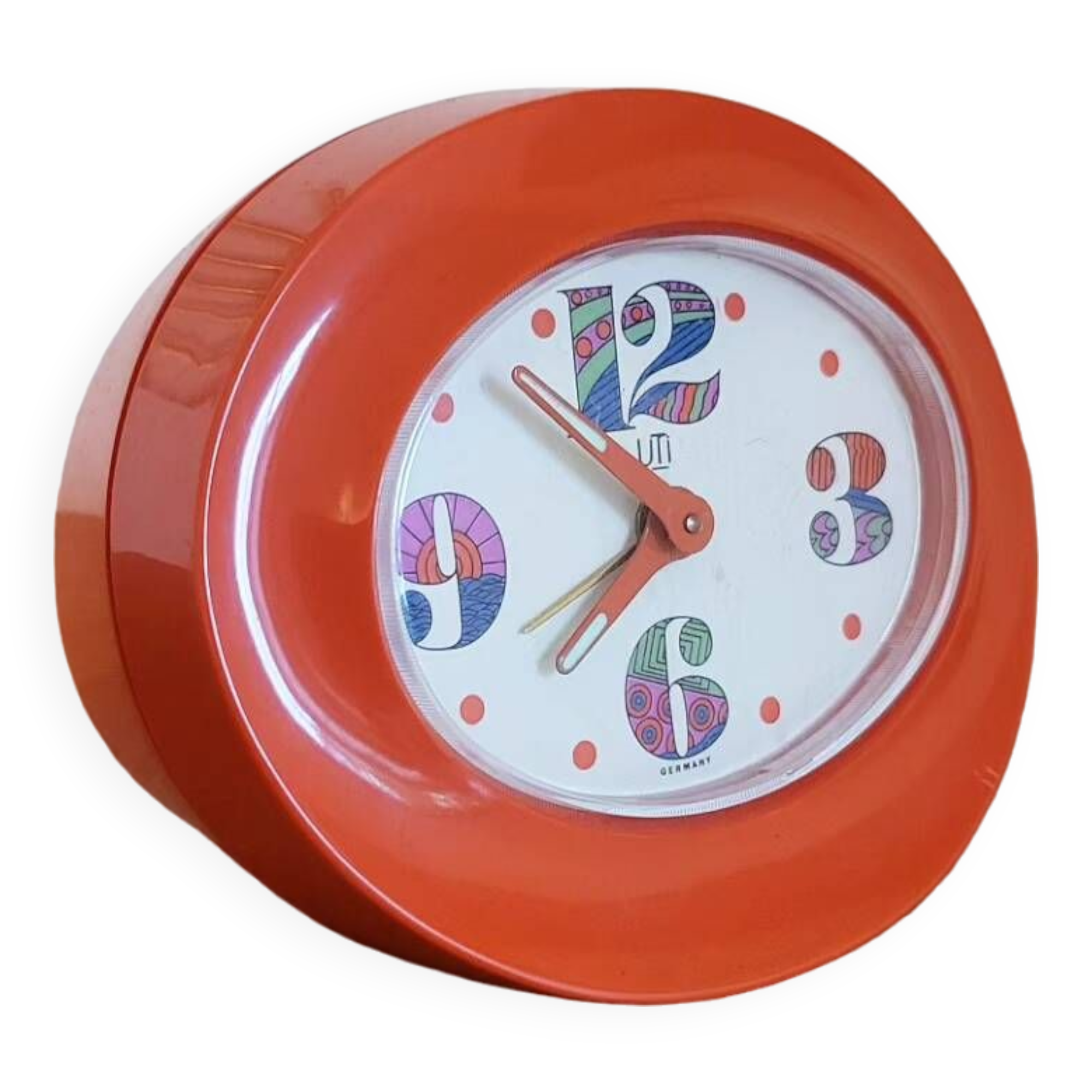 Vintage mechanical alarm clock in orange plastic Uti West Germany