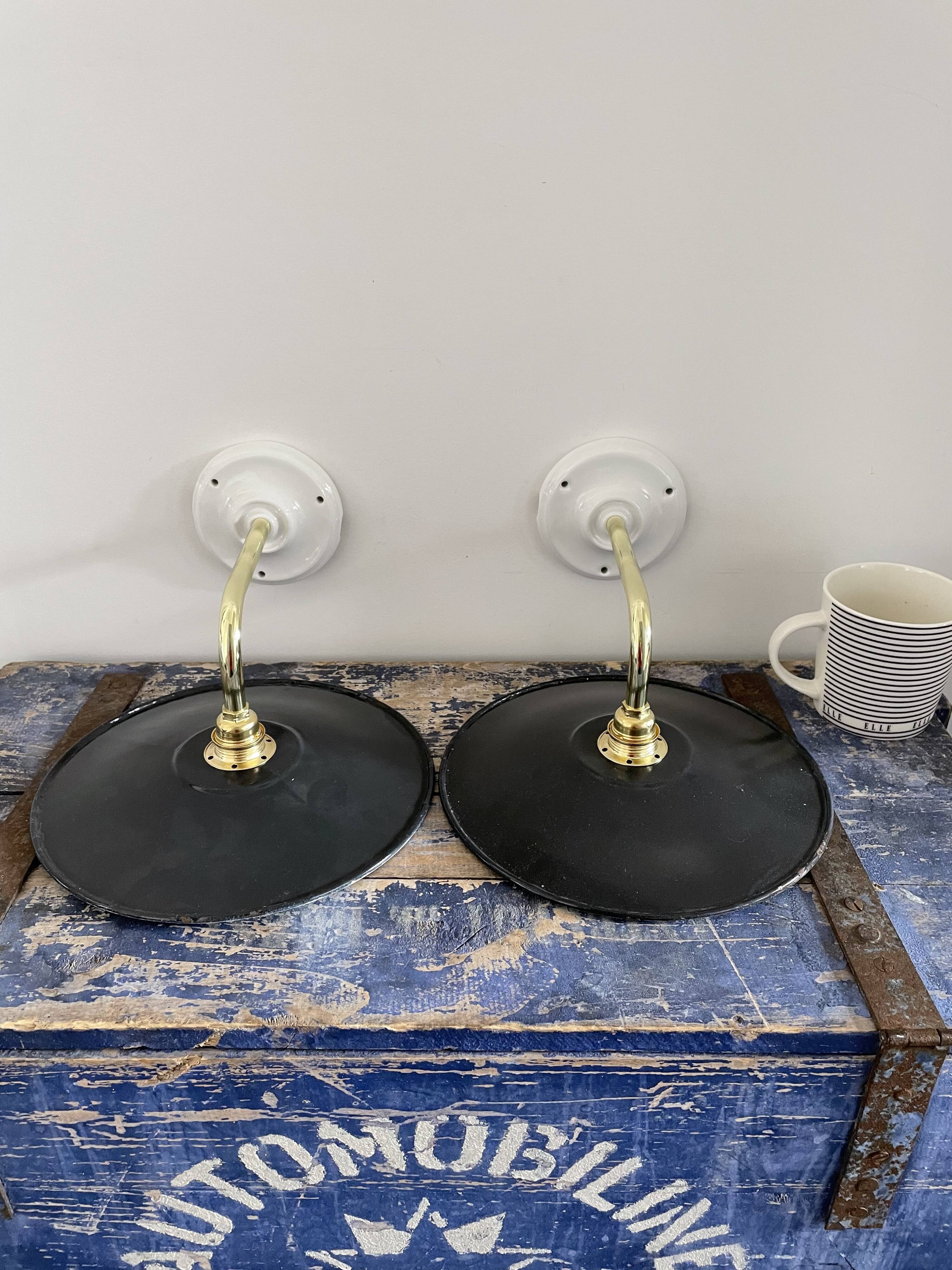 Pair of black enamelled sheet metal wall lamps electrified to nine
