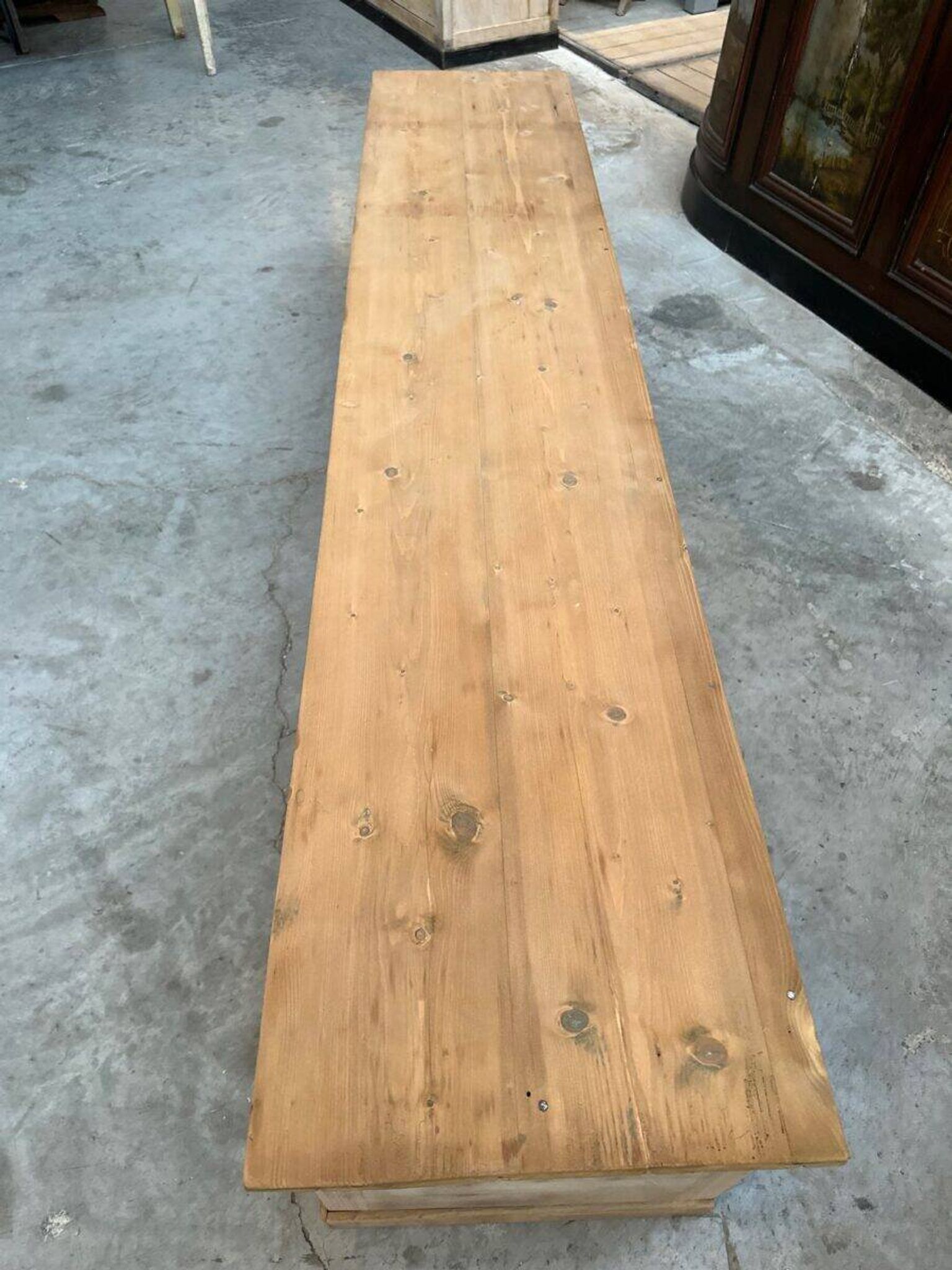 An old piece of workshop furniture transformed into a TV stand