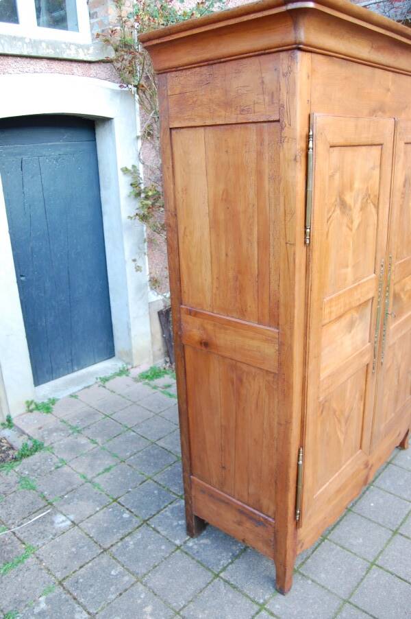 Louis Philippe wardrobe in golden cherry wood from the 19th century.