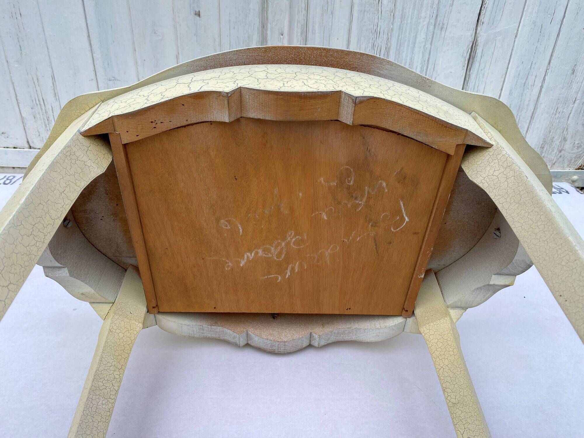Eggshell-coloured drawer with a cracked effect side table.