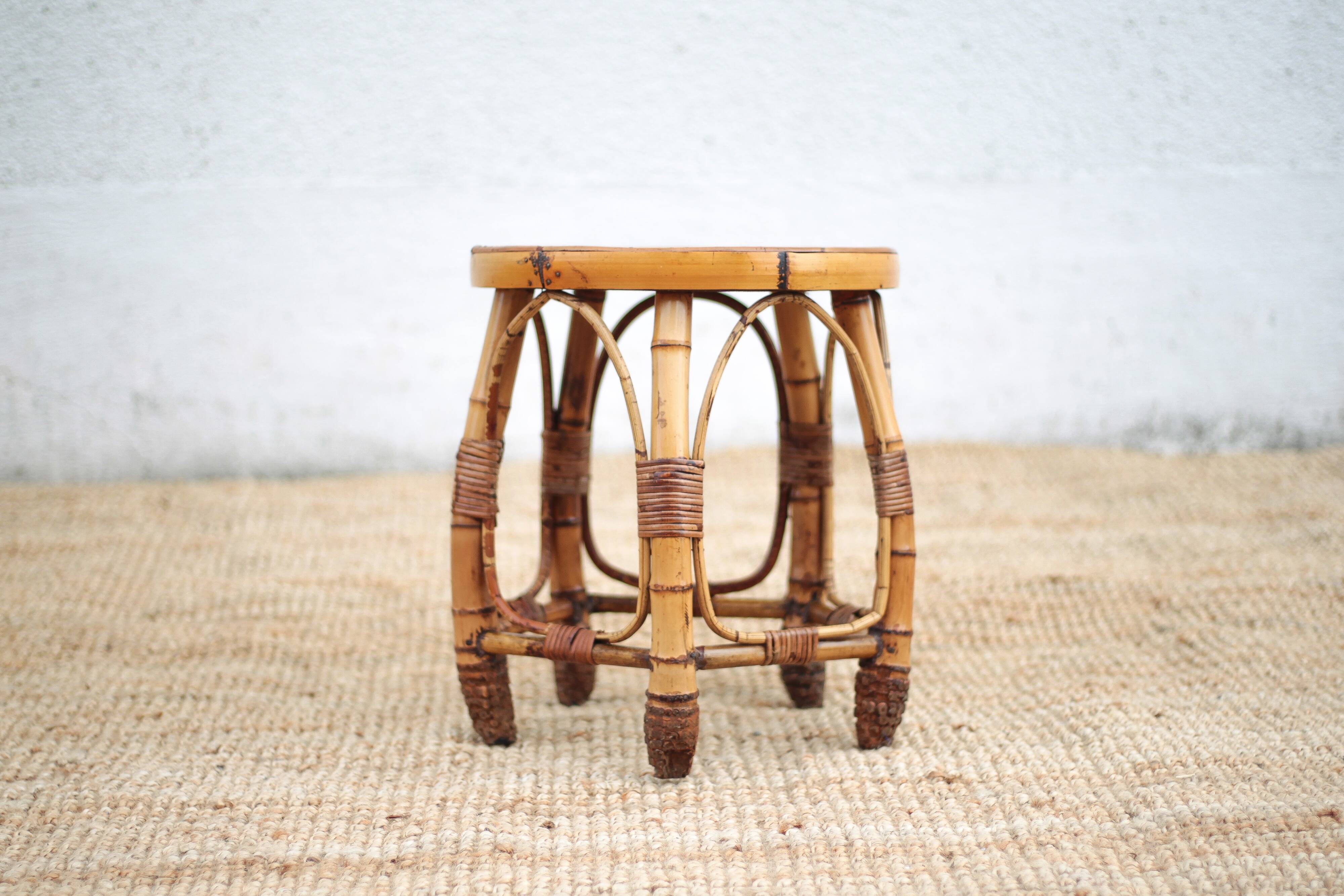 Vintage bamboo stool, woven rattan plant stand, interior decoration.