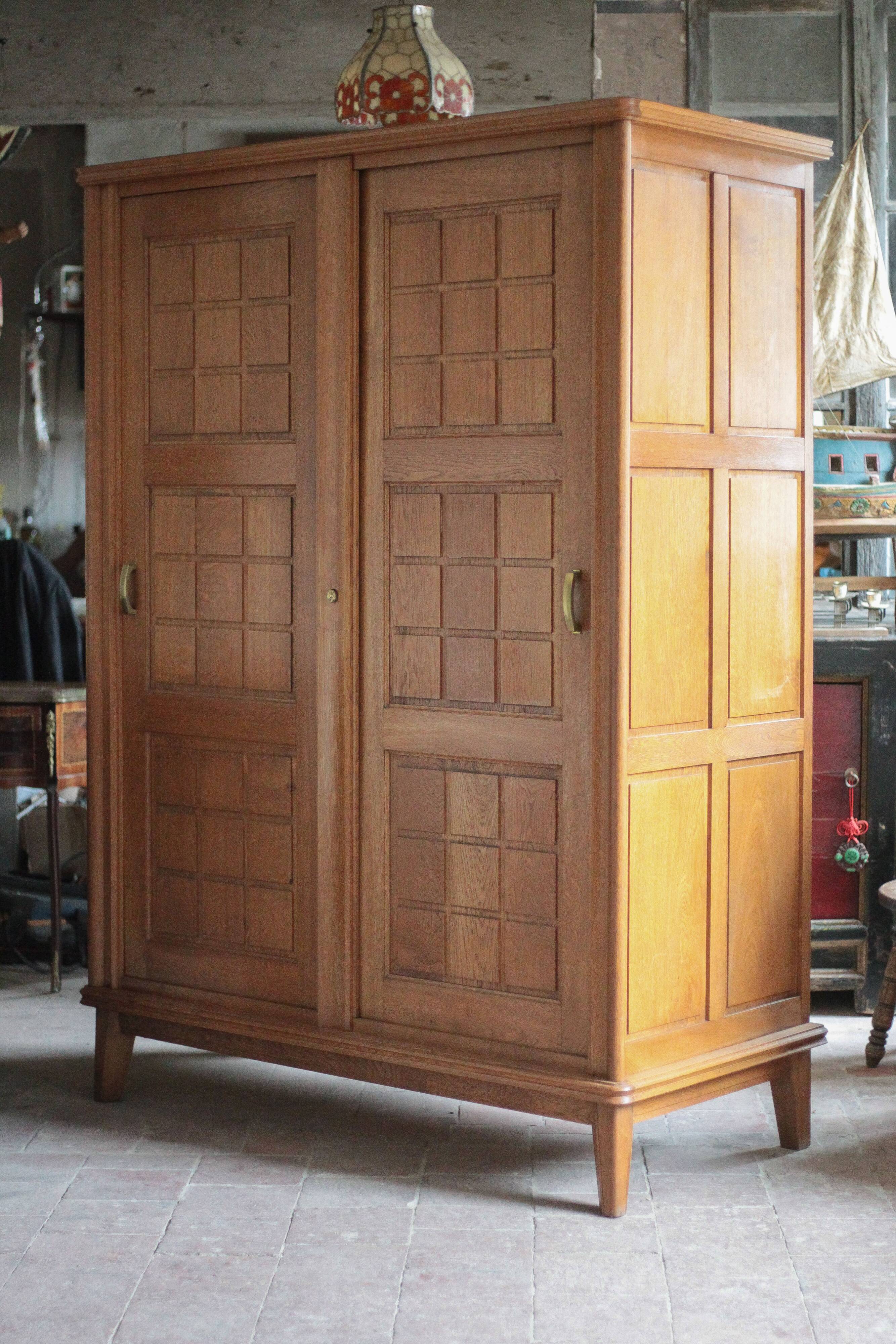 Vintage wooden wardrobe with sliding doors.