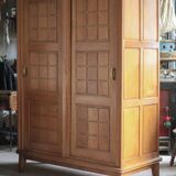 Vintage wooden wardrobe with sliding doors.